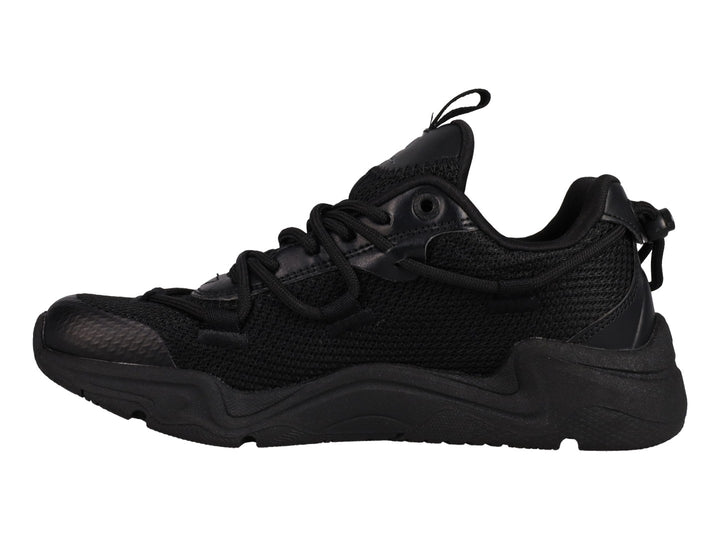 Tenis Champion Hyper C Pilot en color negro total para junior, con suela robusta y detalles en malla y sintético.