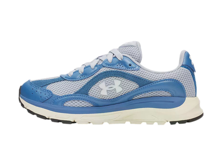 Tenis deportivos Under Armour en tonos azul y gris con suela blanca.
