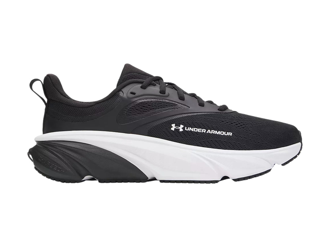 Tenis deportivos Under Armour color negro con suela blanca.