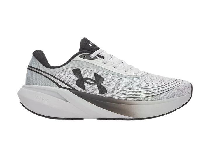 Tenis deportivos Under Armour color gris con detalles negros y suela blanca con degradado.