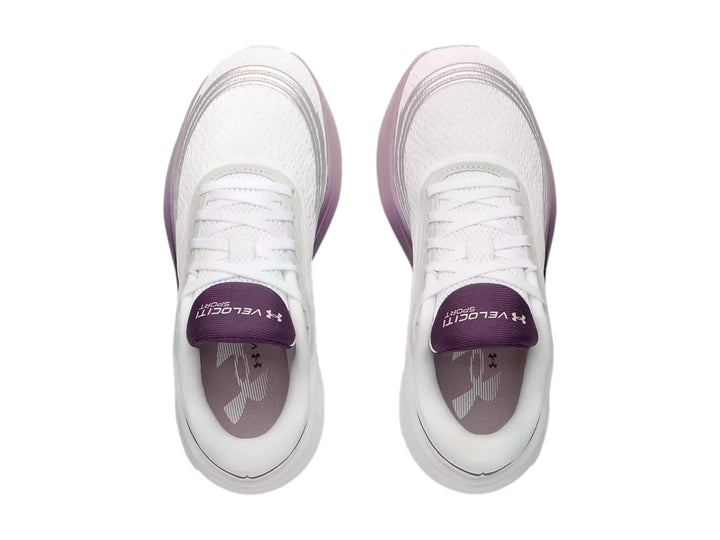 Tenis deportivos Under Armour color blanco con detalles en degradado morado y rosa.