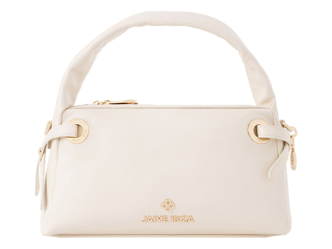 Bolsa de mano color beige de Jaime Ibiza con asa superior y detalles dorados.