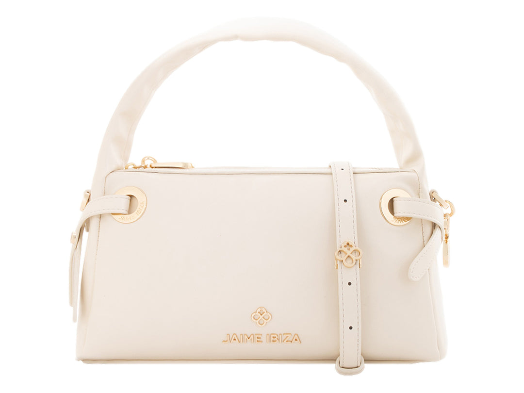 Bolsa de mano color beige de Jaime Ibiza con asa superior y detalles dorados.