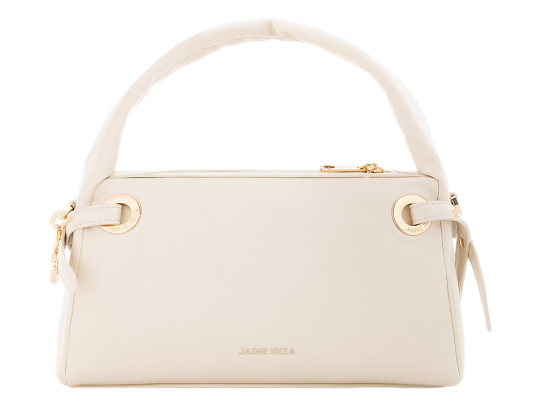 Bolsa de mano color beige de Jaime Ibiza con asa superior y detalles dorados.