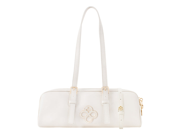 Bolsa de mano color beige de Jaime Ibiza con asas largas y detalles metálicos dorados.