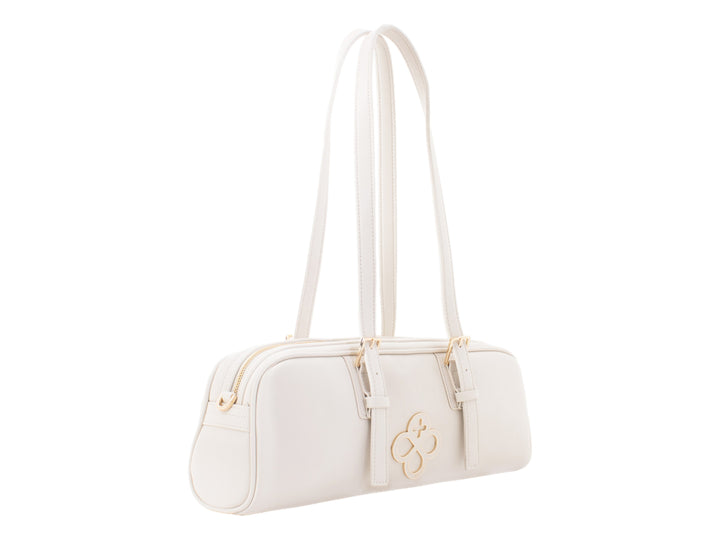 Bolsa de mano color beige de Jaime Ibiza con asas largas y detalles metálicos dorados.
