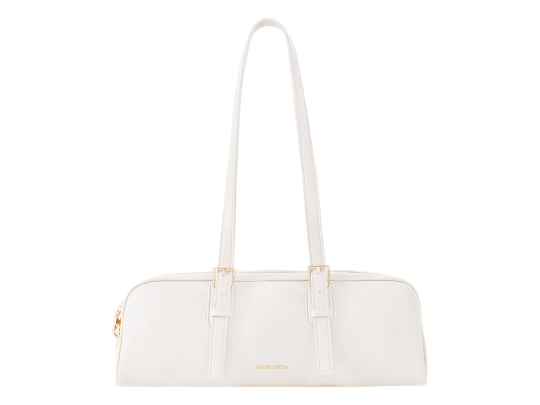 Bolsa de mano color beige de Jaime Ibiza con asas largas y detalles metálicos dorados.