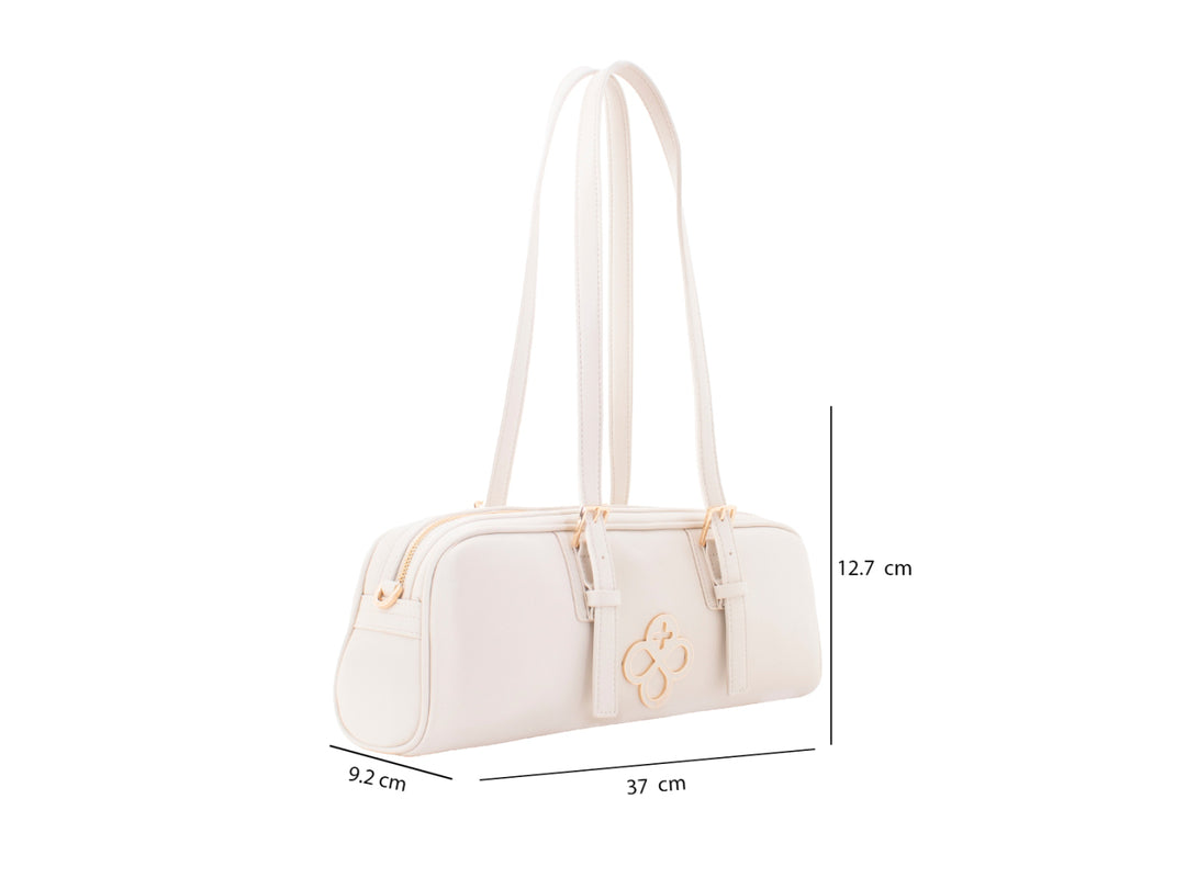 Bolsa de mano color beige de Jaime Ibiza con asas largas y detalles metálicos dorados.