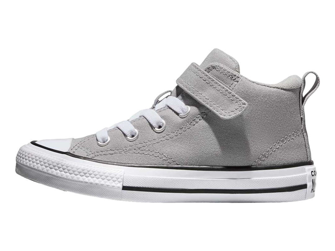 Tenis Converse color gris con suela blanca, agujetas y correa de velcro.