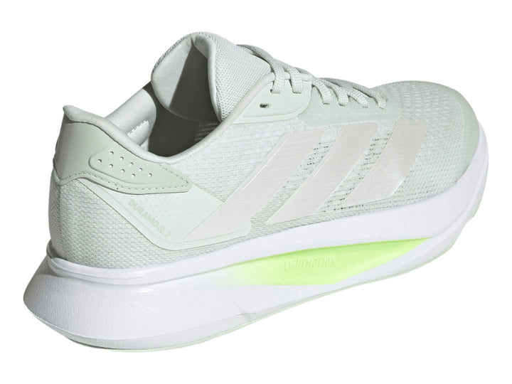 Tenis deportivos Adidas Duramo SL2 color gris con detalles en verde lima y franjas metálicas.