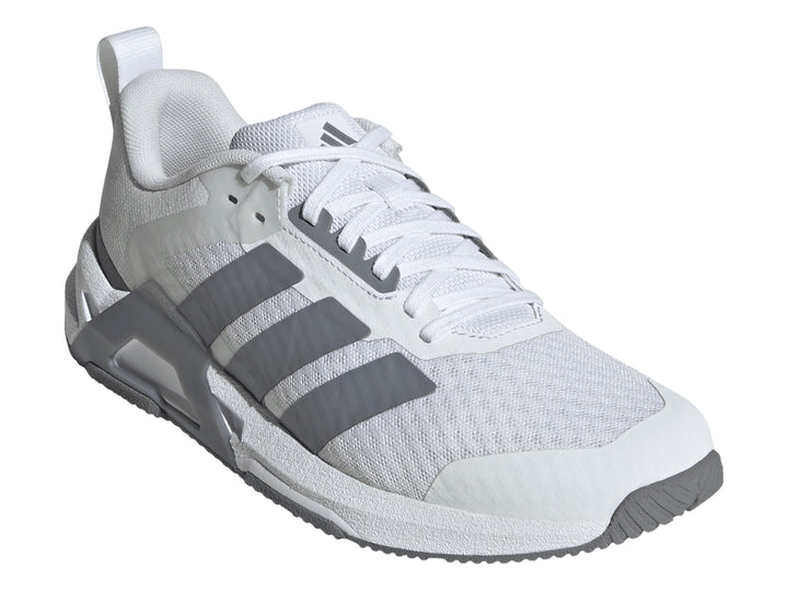Tenis Adidas Dropset Control Tra color blanco con franjas laterales y suela en gris.