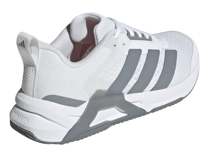 Tenis Adidas Dropset Control Tra color blanco con franjas laterales y suela en gris.