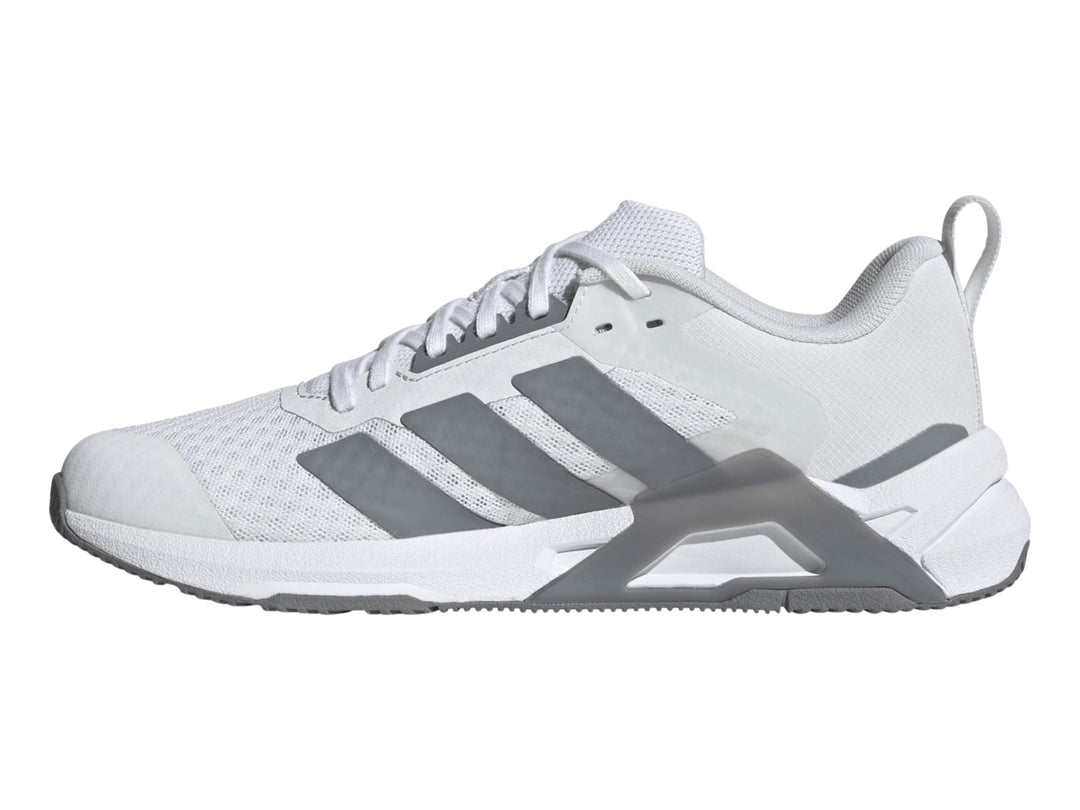Tenis Adidas Dropset Control Tra color blanco con franjas laterales y suela en gris.