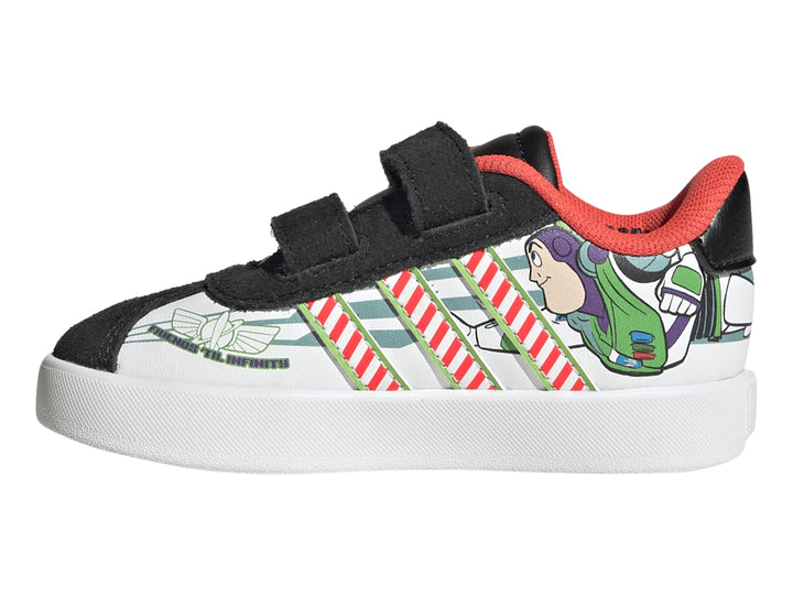 Tenis Adidas negros con estampado de vaca, rayas amarillas y personaje Woody de Toy Story.