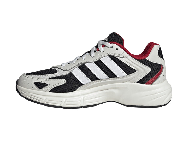 Tenis Adidas Eclyptix 2000 J en color negro con detalles en blanco y rojo, suela blanca gruesa y diseño deportivo.
