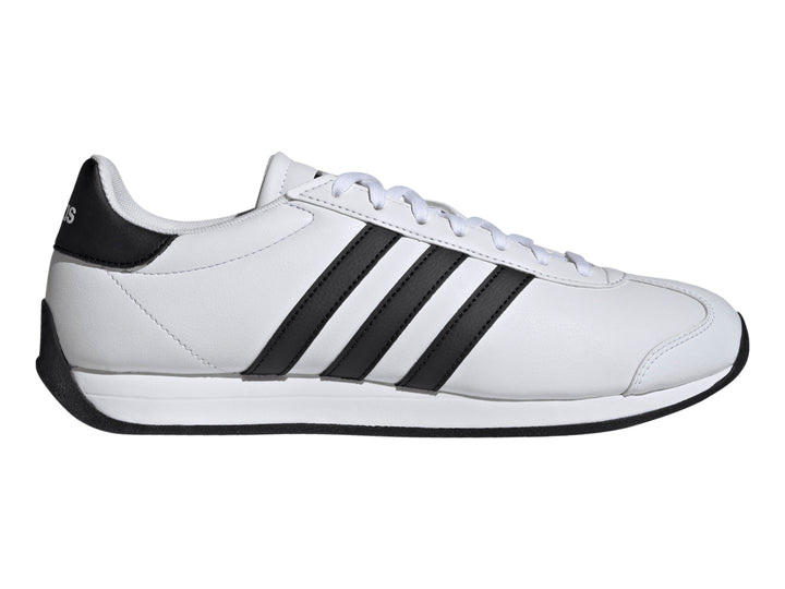 Tenis Adidas Runvist blancos con tres franjas negras laterales y suela negra.
