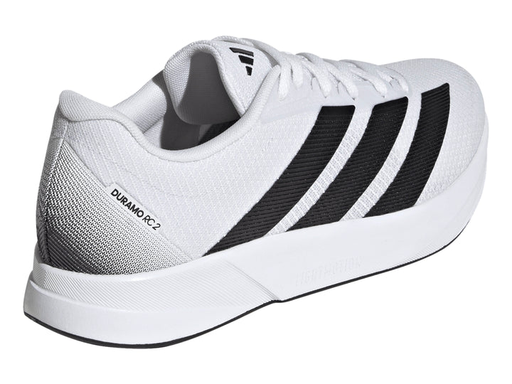 Tenis deportivos Adidas Duramo RC2 blancos con tres franjas negras laterales y suela blanca.