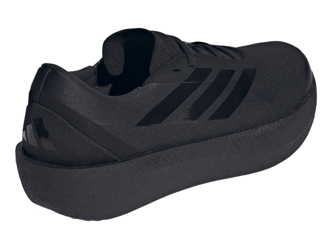 Tenis deportivos Adidas Zenboost color negro con suela gruesa y franjas laterales brillantes.