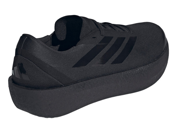 Tenis deportivos Adidas Zenboost color negro con suela gruesa y franjas laterales brillantes.