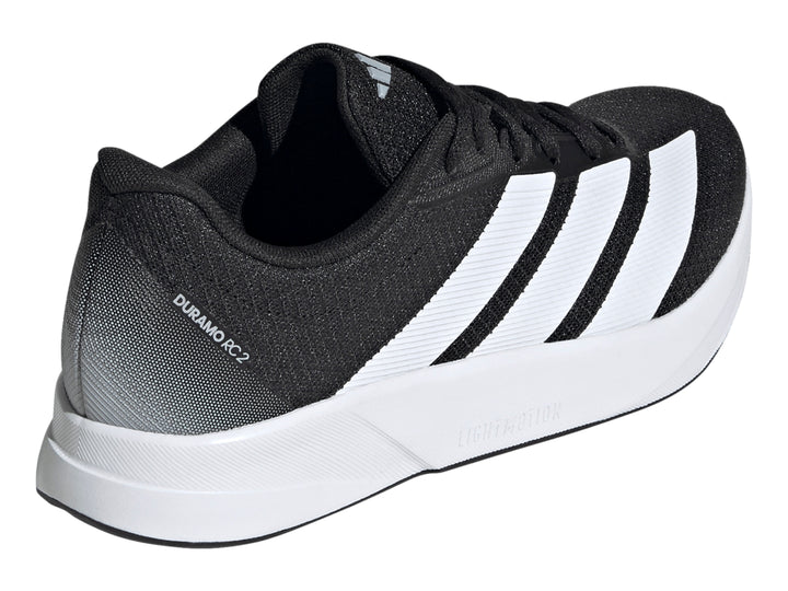 Tenis deportivos Adidas Duramo RC2 color negro con franjas y suela blanca.