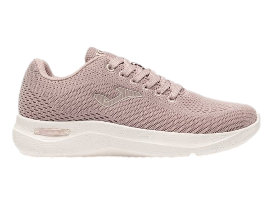 Tenis Joma Corinto color rosa con suela blanca y tejido transpirable.