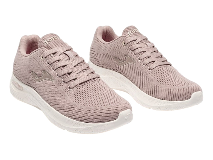 Tenis Joma Corinto color rosa con suela blanca y tejido transpirable.