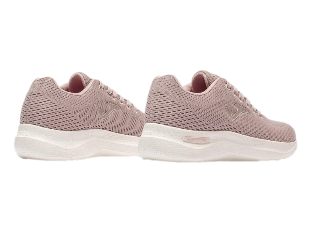 Tenis Joma Corinto color rosa con suela blanca y tejido transpirable.
