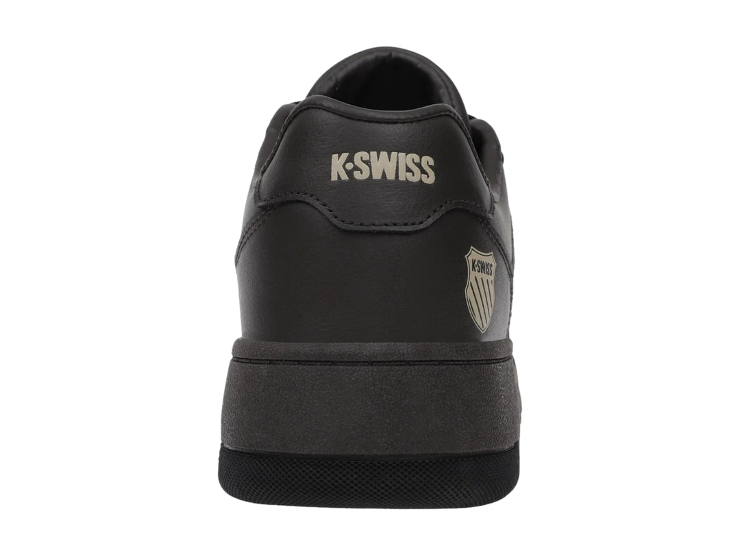 Tenis K-Swiss Morgan Court en color café oscuro y negro, vista lateral.
