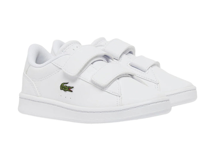 Tenis blancos Lacoste Carnaby Set con cierre de velcro y logotipo del cocodrilo en el costado.