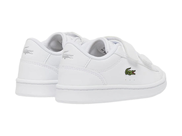 Tenis blancos Lacoste Carnaby Set con cierre de velcro y logotipo del cocodrilo en el costado.