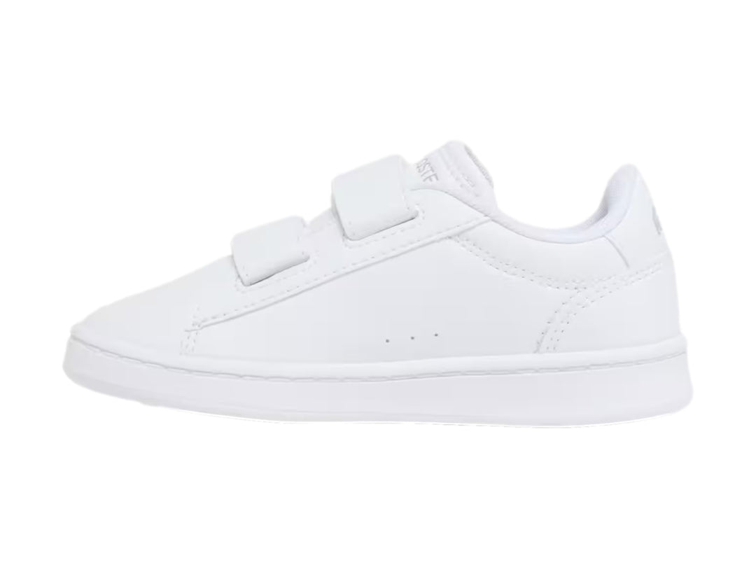 Tenis blancos Lacoste Carnaby Set con cierre de velcro y logotipo del cocodrilo en el costado.
