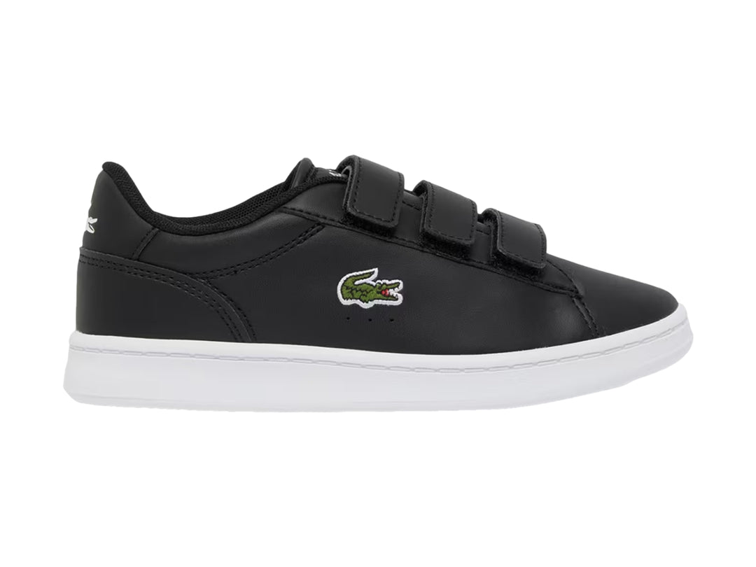 Tenis Lacoste Carnaby Set color negro con suela blanca y cierre de velcro.