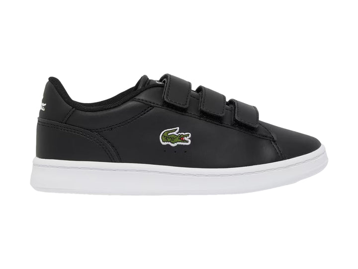 Tenis Lacoste Carnaby Set color negro con suela blanca y cierre de velcro.