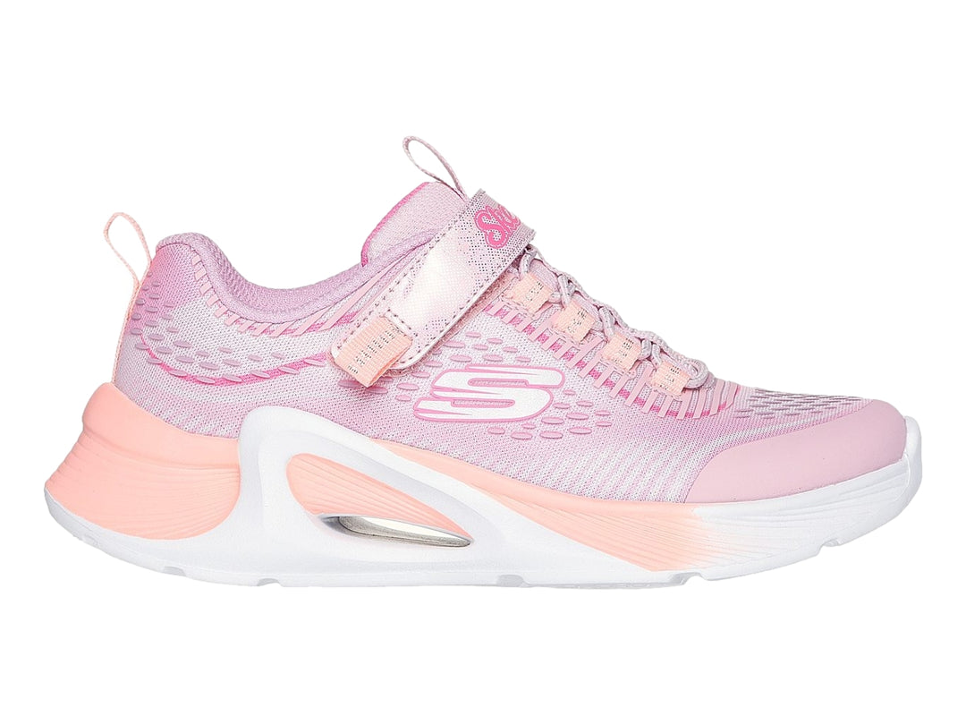 Tenis deportivos Skechers color rosa con suela blanca y correa ajustable.