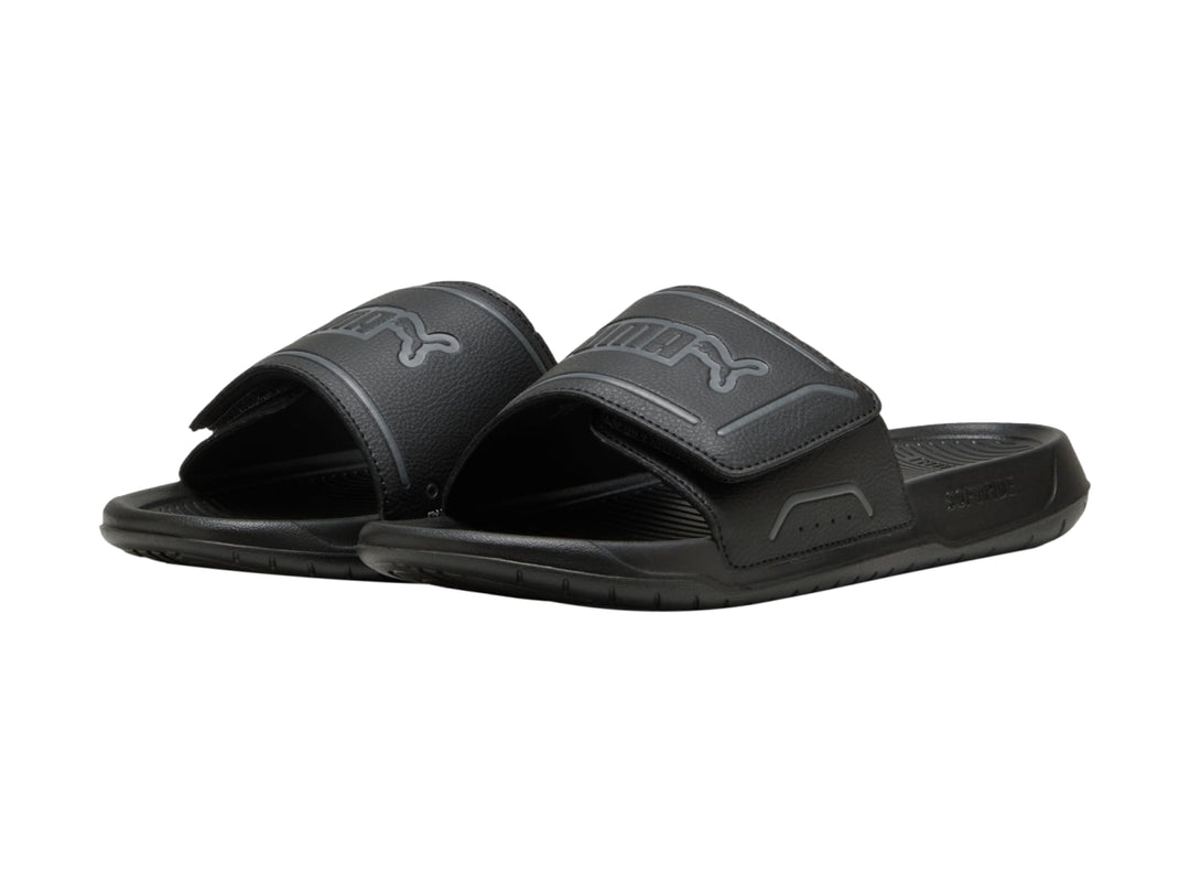 Sandalia PUMA RoyalCat Comfort 2 de color negro, vista lateral sobre fondo blanco.