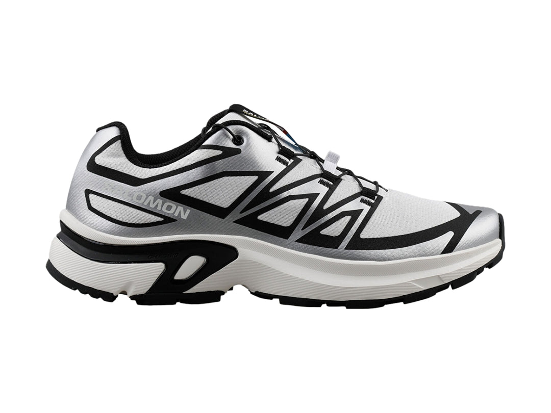 Tenis deportivos Salomon XT-EVR en color blanco con detalles y suela en negro.