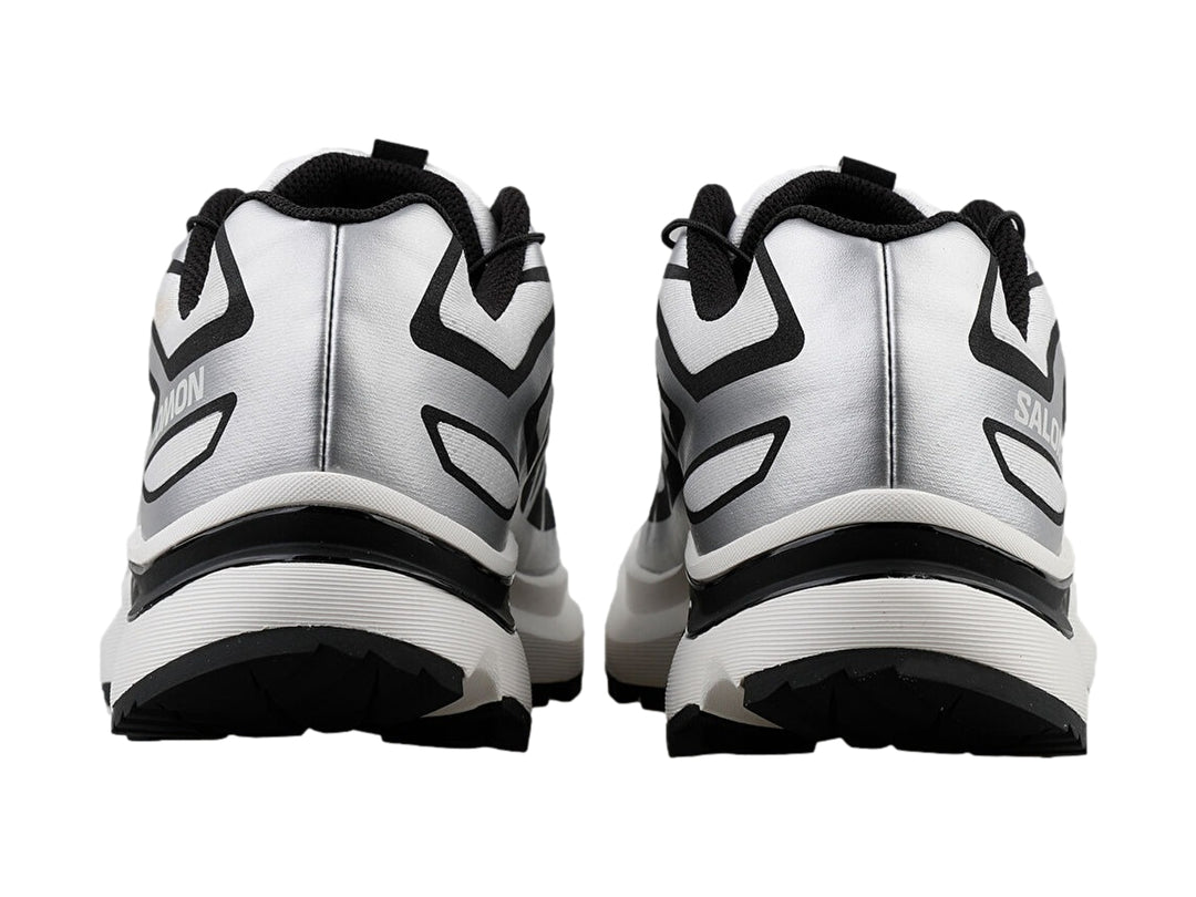 Tenis deportivos Salomon XT-EVR en color blanco con detalles y suela en negro.