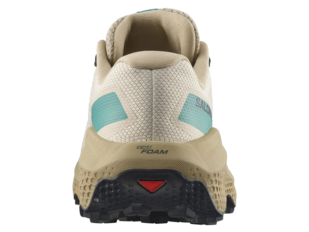Tenis deportivos Salomon Ultra Flow 2 color café claro con detalles turquesa y suela negra.