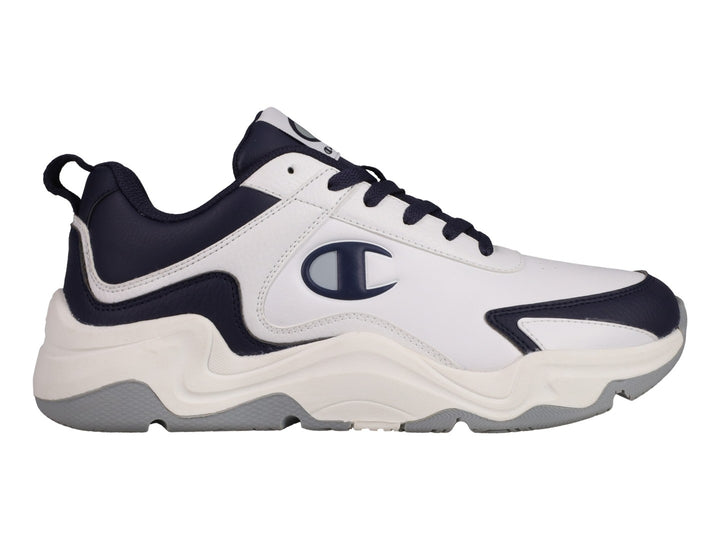 Tenis Champion Hyper V3 Next en color blanco con detalles en azul marino y suela blanca y gris.