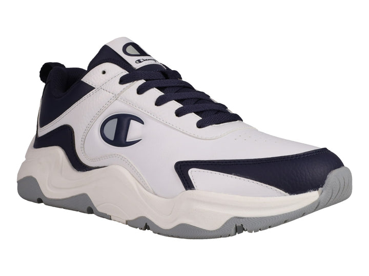 Tenis Champion Hyper V3 Next en color blanco con detalles en azul marino y suela blanca y gris.