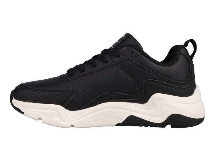 Tenis Champion Hyper V3 Next color negro con suela blanca gruesa y logo plateado lateral.