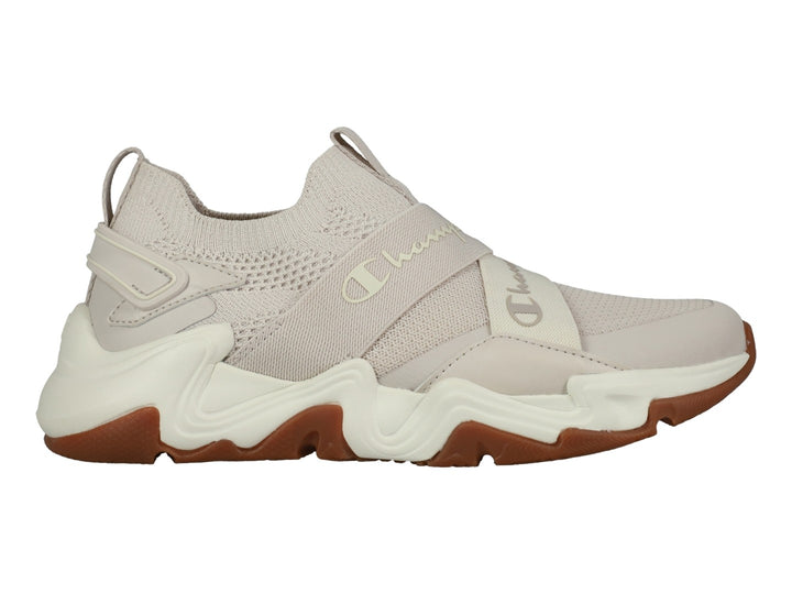 Tenis Champion Hyper Neo Low en color beige con suela blanca y marrón, diseño deportivo de tejido sin cordones.