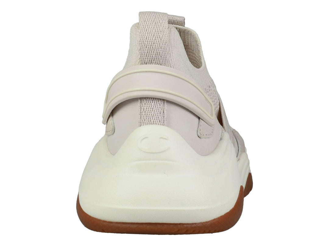Tenis Champion Hyper Neo Low en color beige con suela blanca y marrón, diseño deportivo de tejido sin cordones.