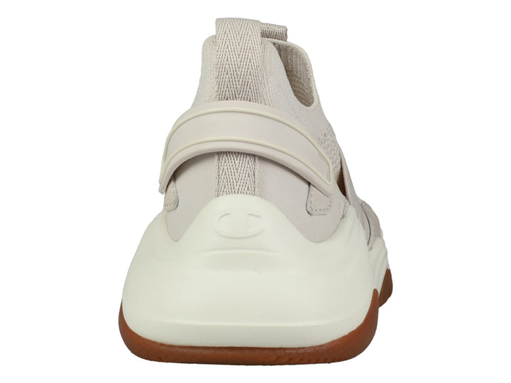 Tenis Champion Hyper Neo Low en color beige con suela blanca y marrón, diseño deportivo de tejido sin cordones.