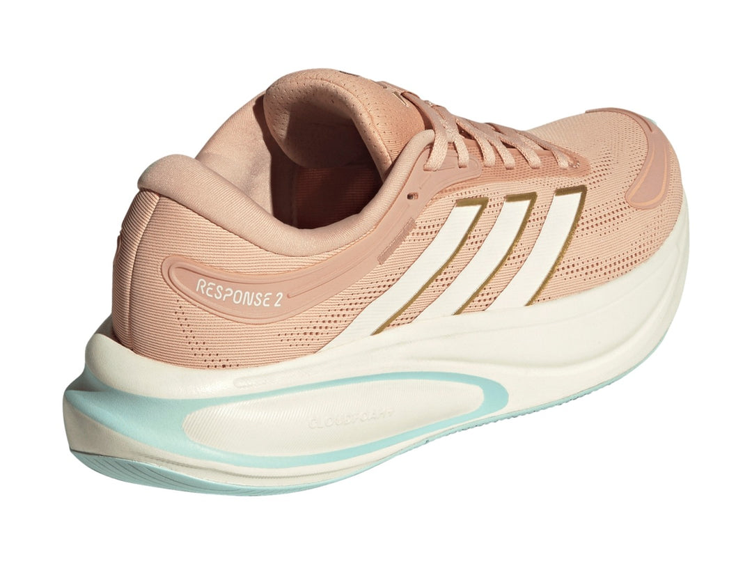 Tenis Adidas Response 2 en color rubor con franjas blancas y suela blanca con detalles en menta.