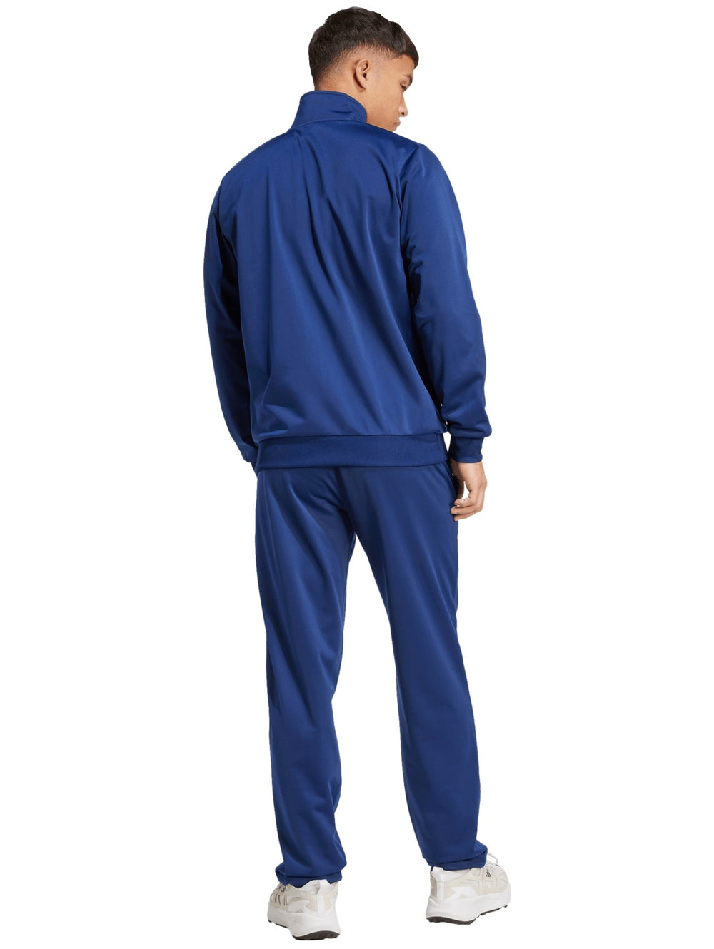 Conjunto deportivo Adidas azul compuesto por chaqueta con cierre y pantalón largo para hombre.