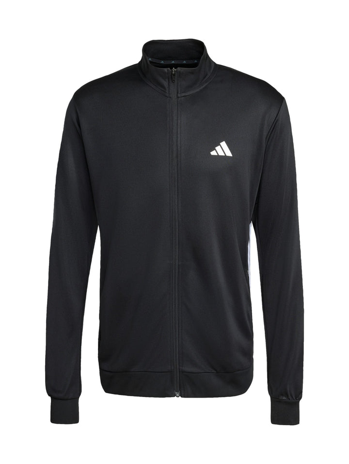 Hombre vistiendo chaqueta deportiva Adidas color negro con detalles blancos y cierre frontal completo.