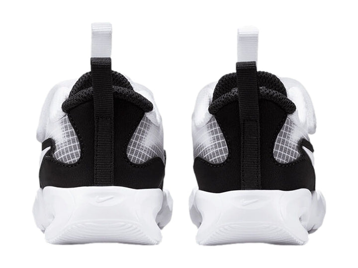 Tenis Nike Air Max Nova en colores blanco y negro con suela blanca gruesa y cierre de velcro.