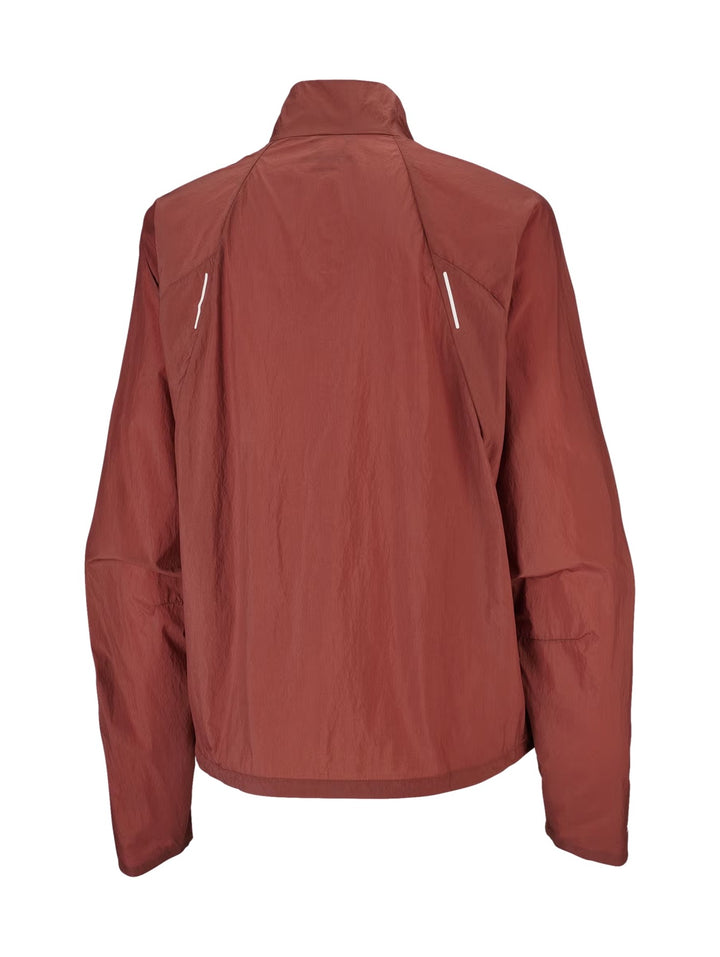 Chaqueta deportiva Salomon Shakeout Fly en color Burnt Umber con cierre frontal y cuello alto.