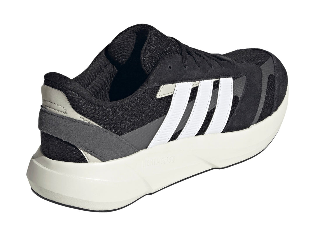 Tenis Adidas Lightshift 2.0 en color negro con franjas blancas y suela blanca Lightmotion.